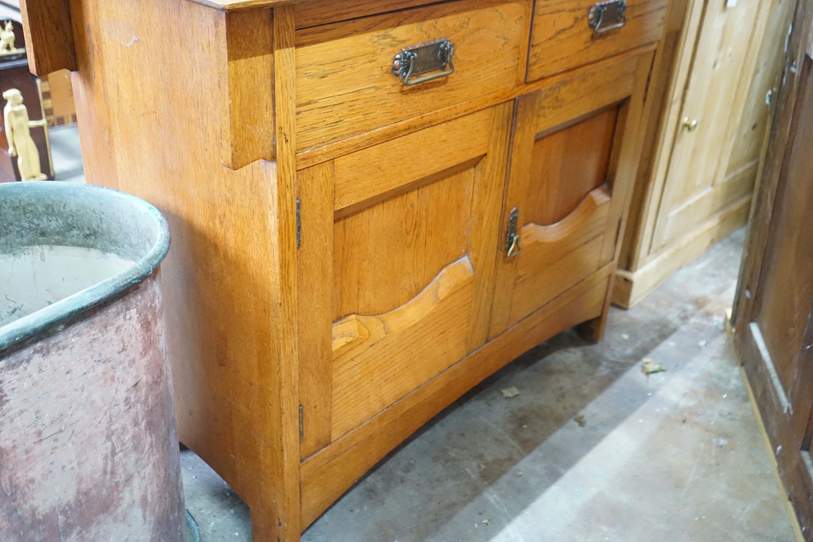 An Art Nouveau oak mirror back sideboard, length 122cm, depth 55cm, height 145cm